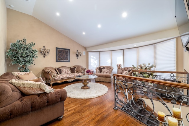 living room with lofted ceiling and hardwood / wood-style flooring