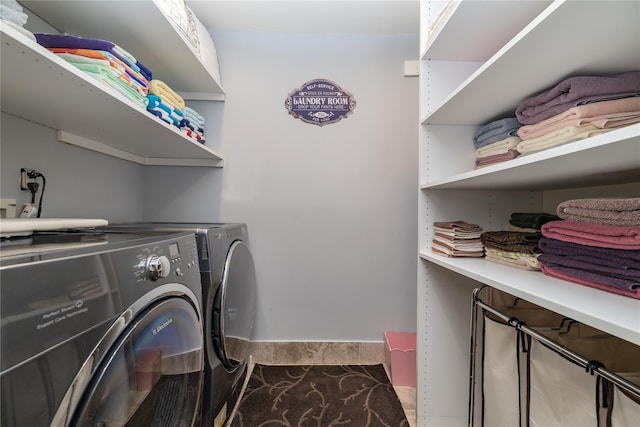 laundry area with separate washer and dryer