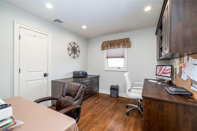 home office with dark hardwood / wood-style floors