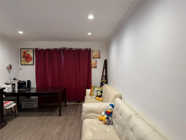 living room with hardwood / wood-style floors and ornamental molding