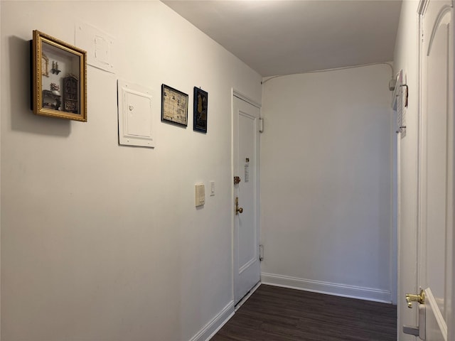 corridor featuring dark hardwood / wood-style floors