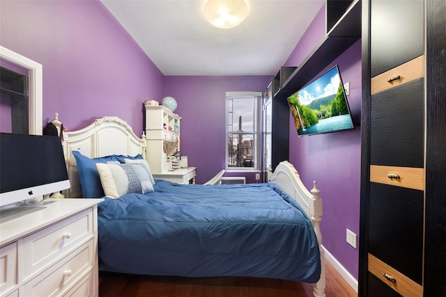 bedroom featuring dark hardwood / wood-style floors