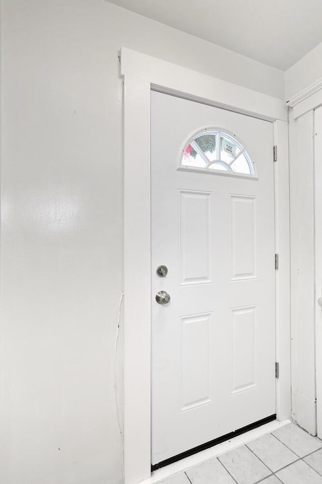 entryway featuring light tile patterned floors