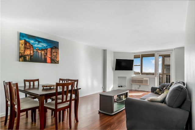 living room with dark hardwood / wood-style floors and a wall mounted AC