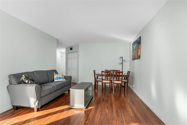 living room with dark hardwood / wood-style flooring