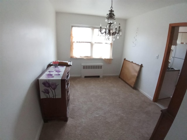 interior space featuring radiator, light colored carpet, and an inviting chandelier