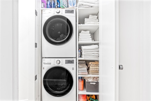 washroom with stacked washer / drying machine