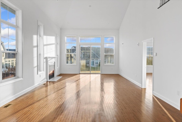 unfurnished sunroom featuring lofted ceiling