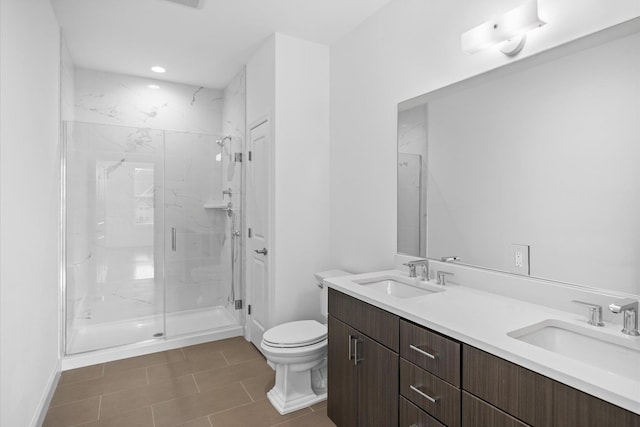 bathroom with tile patterned floors, toilet, an enclosed shower, and vanity