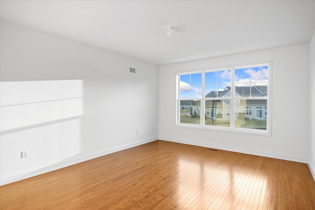 empty room featuring wood-type flooring