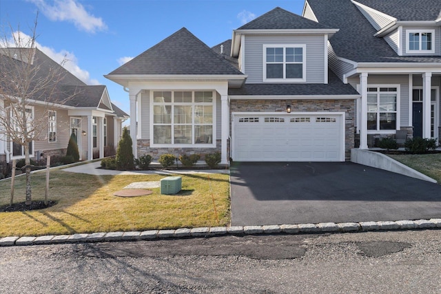 view of front facade featuring a garage and a front lawn