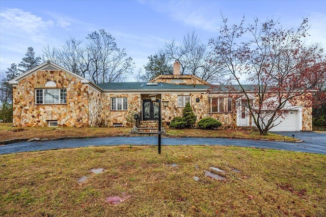 ranch-style house with a front lawn