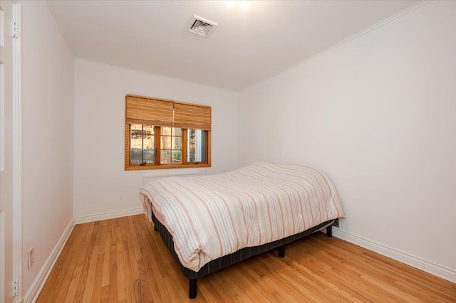 bedroom featuring hardwood / wood-style floors