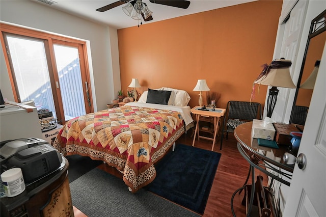 bedroom featuring ceiling fan and dark hardwood / wood-style flooring