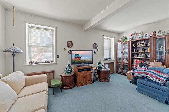 carpeted living room featuring beamed ceiling