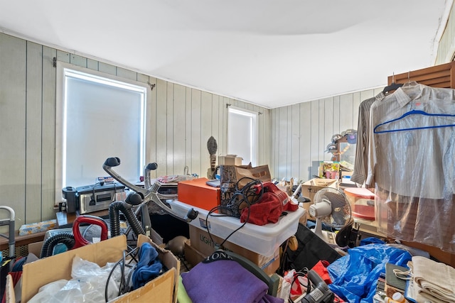 miscellaneous room featuring wood walls