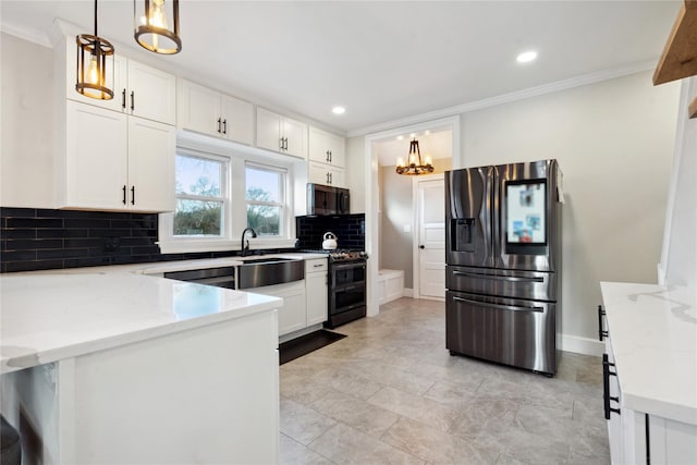 kitchen featuring decorative light fixtures, light stone counters, white cabinetry, and stainless steel appliances