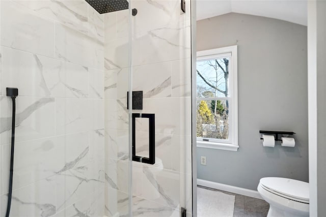 bathroom with toilet, walk in shower, and lofted ceiling