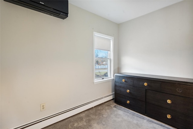 carpeted bedroom with a baseboard radiator and a wall mounted air conditioner