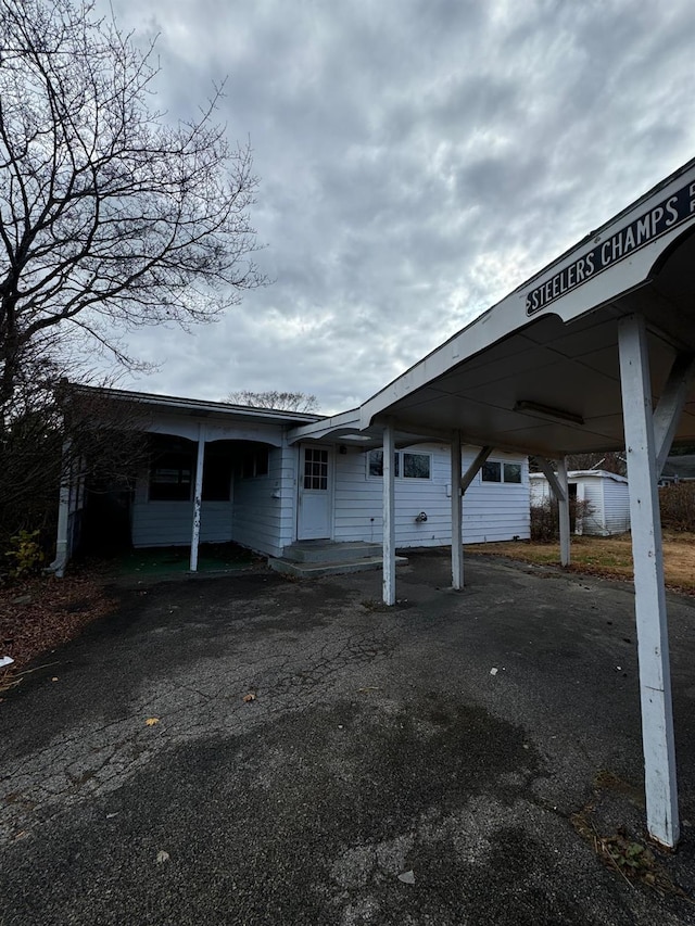 exterior space featuring a carport