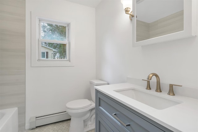 bathroom with a baseboard heating unit, vanity, and toilet