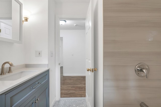 bathroom with vanity and a shower