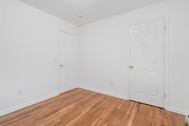 spare room featuring light wood-type flooring