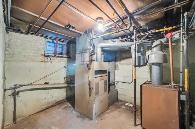 utility room featuring heating unit