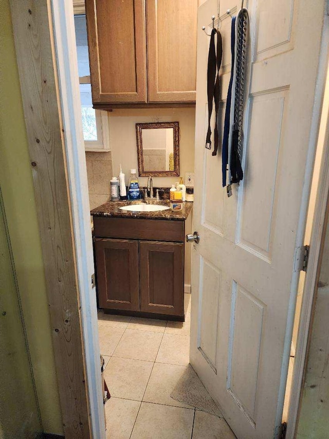 bathroom with tile patterned floors and vanity