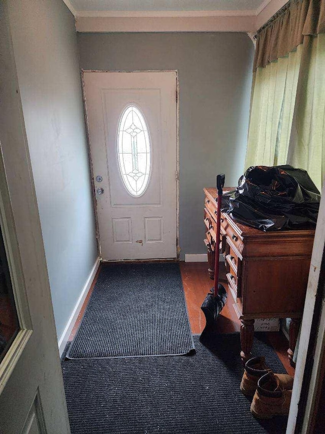 foyer featuring crown molding