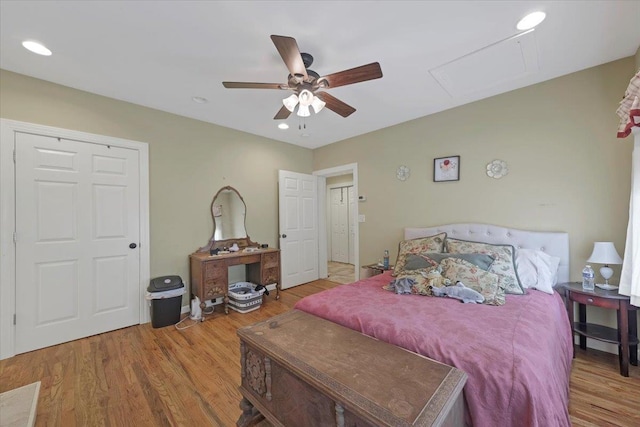 bedroom featuring ceiling fan and light hardwood / wood-style flooring