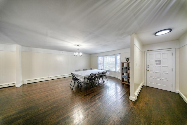 dining area with a chandelier, dark hardwood / wood-style flooring, and a baseboard heating unit