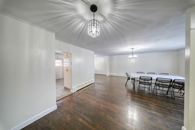 dining space featuring a baseboard radiator, dark hardwood / wood-style floors, and an inviting chandelier