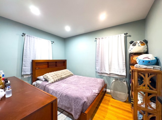 bedroom with light hardwood / wood-style floors