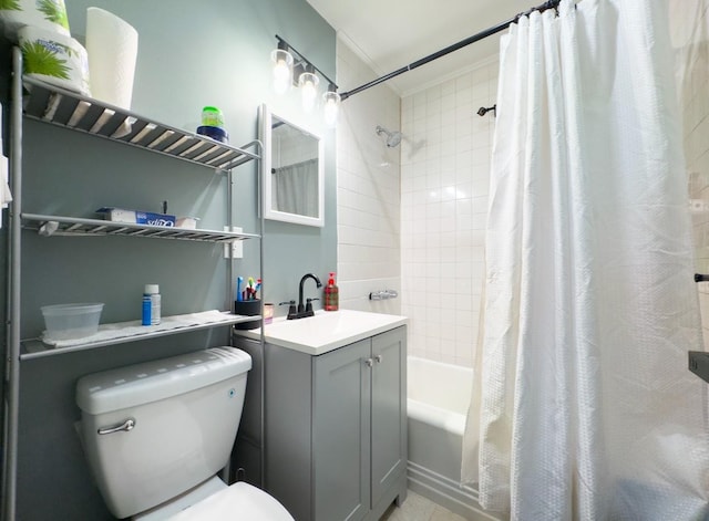 full bathroom featuring shower / bath combo, vanity, and toilet