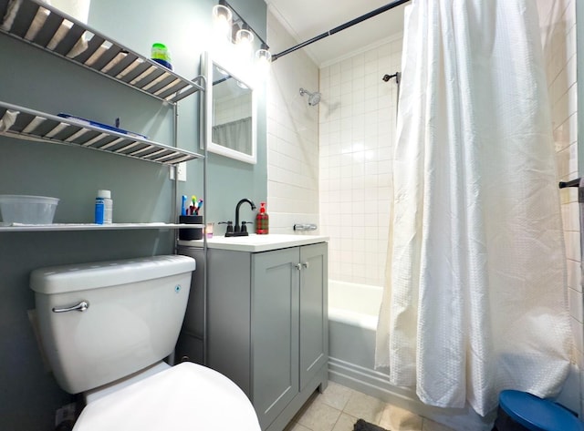 full bathroom featuring tile patterned floors, shower / bath combo with shower curtain, vanity, and toilet