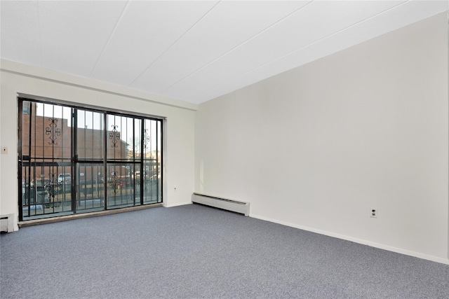 empty room featuring carpet flooring and a baseboard radiator