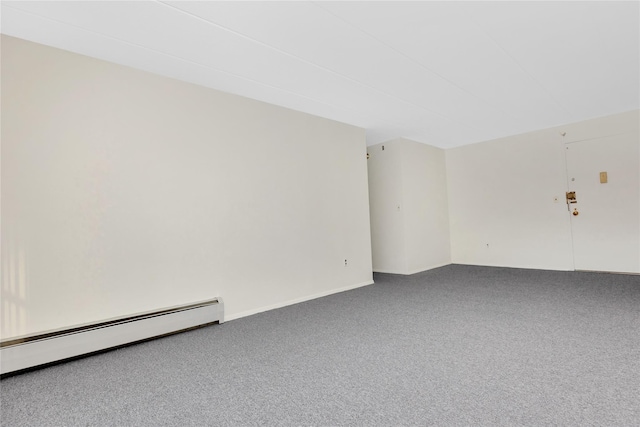 empty room with carpet and a baseboard radiator