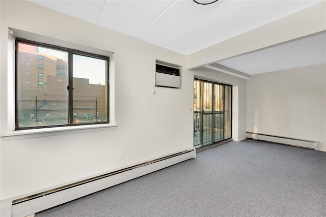 unfurnished room featuring an AC wall unit and a baseboard heating unit