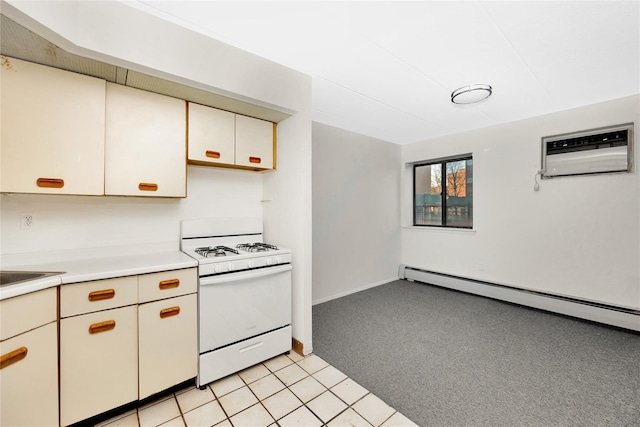 kitchen featuring light carpet, white range oven, a wall mounted AC, and a baseboard heating unit