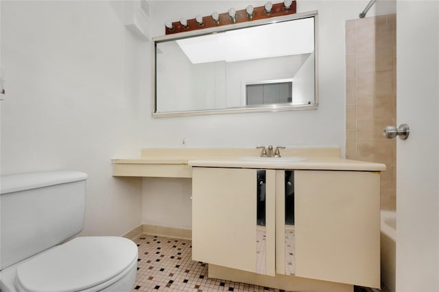 full bathroom featuring tile patterned floors, vanity, toilet, and tiled shower / bath