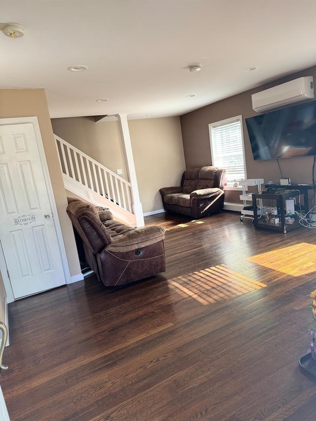29 Oak St, Islip, NY 11751 - living room featuring an AC wall unit, wood finished floors, stairway, baseboards, and recessed lighting