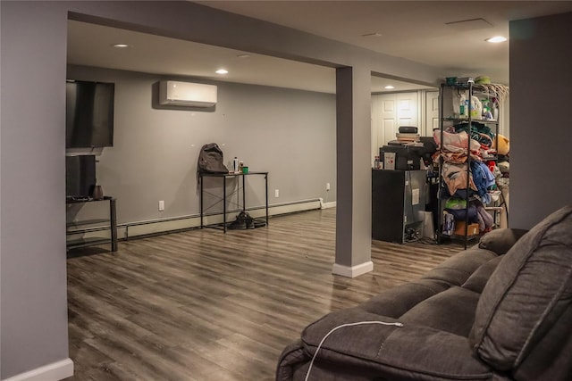 29 Oak St, Islip, NY 11751 - living area featuring a wall mounted AC, a baseboard radiator, baseboards, wood finished floors, and recessed lighting