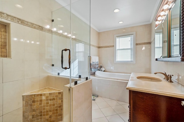 bathroom featuring vanity, plus walk in shower, tile patterned floors, ornamental molding, and tile walls