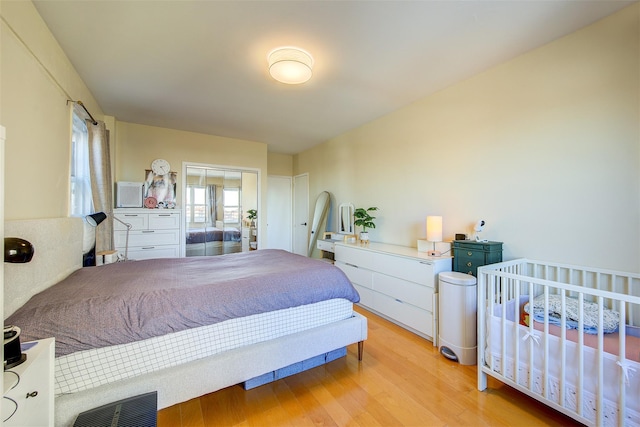 bedroom with light hardwood / wood-style flooring