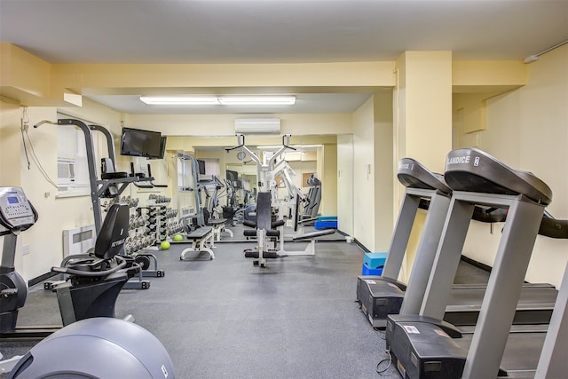 exercise room with an AC wall unit