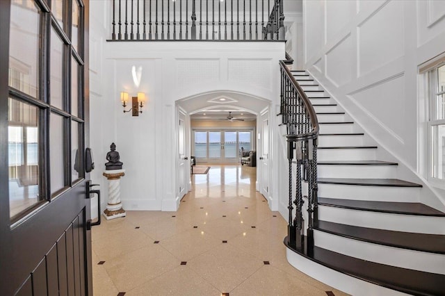 foyer featuring a high ceiling