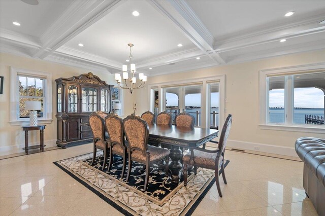 dining space featuring a chandelier, a water view, crown molding, and beamed ceiling