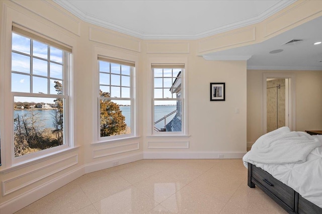 bedroom with crown molding and a water view