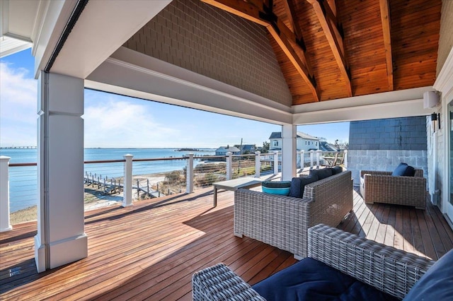 wooden terrace featuring a water view